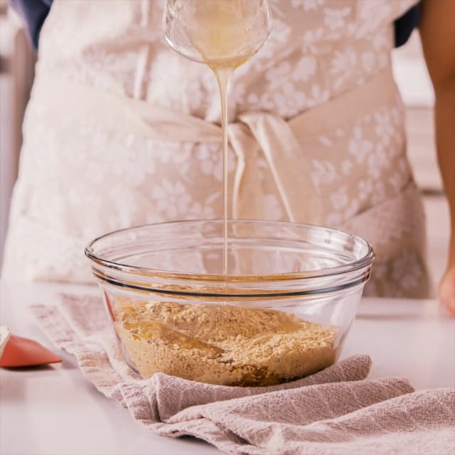 Step 1: Adding water and honey to protein ball mix